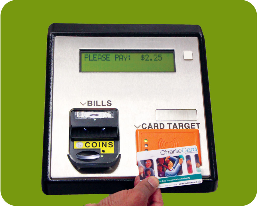 Image of hand swiping CharlieCard over farebox. 